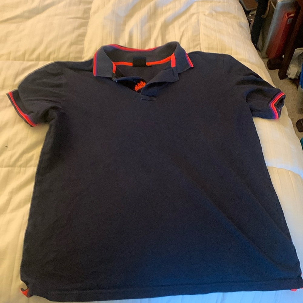 Sunder large woman’s polo. Orange and dark blue